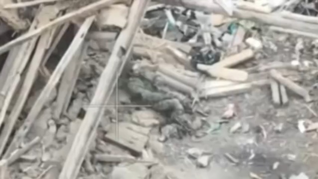 Unequipped Russian soldier shoots himself while sitting on the rubble. Footage presumably from much earlier
