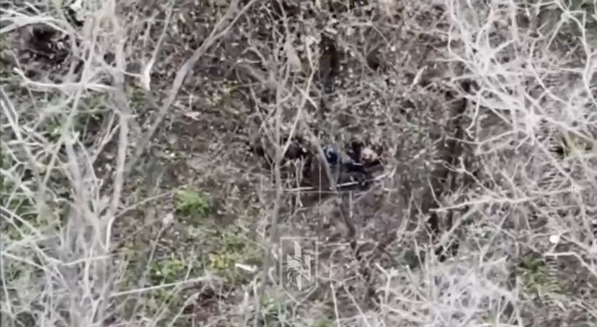 Unequipped Russian appears to be stabbing himself in the neck repeatedly while something hits nearby. Still alive, he then proceeds to point AK at his temple and shoot himself