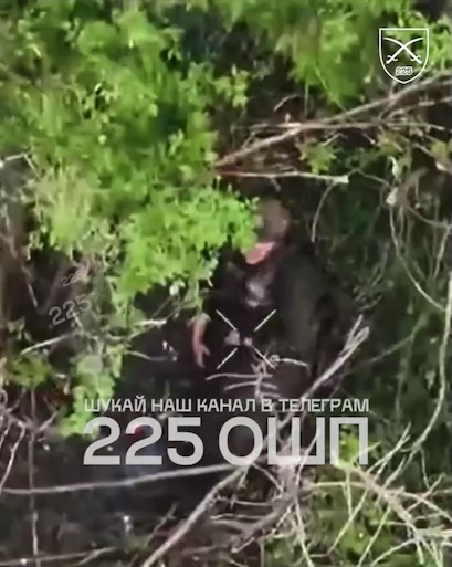 Fully equipped Russian is hiding under foliage, receives FPV hit. He then shoots himself, his helmet blown off but he's stil alive. He appears to try again but it isn't clear whether he pulls the trigger. Video jumps to the aftermath featuring him lying still with blood on his head