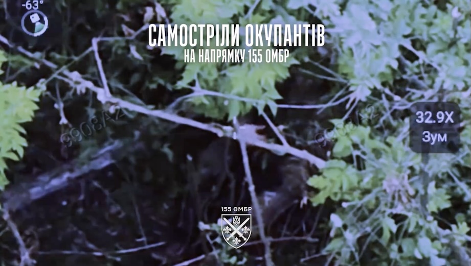 Russian soldier is seen through dense foliage pulling trigger on his rifle and falling back